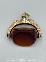 MaxSold Auction: 9ct Gold Amber Spinner Watch Fob Stamped 375 “P”  4.10 Grams - Esquimalt (British Columbia, Canada) PARTNER MANAGED Estate Sale Online Auction - Lampson Street