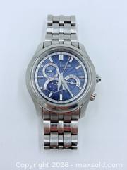 MaxSold Auction: Citizen Eco-Drive Calibre 8651 moon phase watch with a blue dial and stainless steel bracelet - Esquimalt (British Columbia, Canada) PARTNER MANAGED Estate Sale Online Auction - Lampson Street