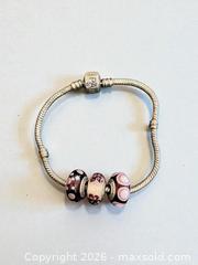 MaxSold Auction: Sterling Silver Pandora Bracelet with 3 Pandora Glass Beads 7.5" Length  21.7 Grams - Esquimalt (British Columbia, Canada) PARTNER MANAGED Estate Sale Online Auction - Lampson Street
