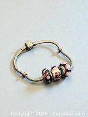 MaxSold Auction: Sterling Silver Pandora Bracelet with 3 Pandora Glass Beads 7.5" Length  21.7 Grams - Esquimalt (British Columbia, Canada) PARTNER MANAGED Estate Sale Online Auction - Lampson Street
