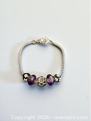 MaxSold Auction: Sterling Silver Pandora Bracelet with 5 Pandora Beads 8.5" Length  30.6 Grams - Esquimalt (British Columbia, Canada) PARTNER MANAGED Estate Sale Online Auction - Lampson Street