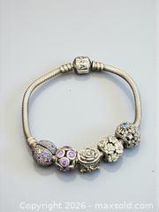 MaxSold Auction: Sterling Silver Pandora Bracelet with Pandora Gemstone Beads 7" Length  29.82 Grams - Esquimalt (British Columbia, Canada) PARTNER MANAGED Estate Sale Online Auction - Lampson Street