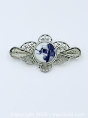 MaxSold Auction: Vintage Dutch Delft Blue and White Porcelain Windmill Brooch with a Silver Filigree Setting - Esquimalt (British Columbia, Canada) PARTNER MANAGED Estate Sale Online Auction - Lampson Street