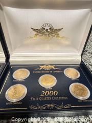 MaxSold Auction: 1999 and 2000 Commemorative Coin Sets, 24Kt Gold Plated (2 Sets) - Douglasville (Georgia, USA) PARTNER MANAGED Downsizing Online Auction - Highway 92 - Fairburn Road (CONDO)