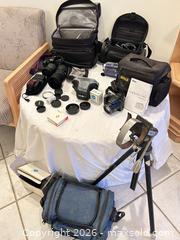 MaxSold Auction: Mixed camera gear lot: Canon SLR, lenses, Sony Handycam, Nikon Coolpix - Toronto (Ontario, Canada) PARTNER MANAGED Downsizing Online Auction - Creekwood Drive