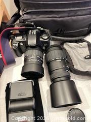 MaxSold Auction: Mixed camera gear lot: Canon SLR, lenses, Sony Handycam, Nikon Coolpix - Toronto (Ontario, Canada) PARTNER MANAGED Downsizing Online Auction - Creekwood Drive