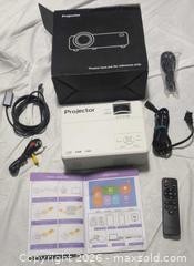 MaxSold Auction: Projector  - Gloucester (Massachusetts, USA) SELLER MANAGED Downsizing Online Auction -  Fremont Street