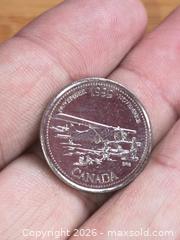 MaxSold Auction: Airplane Milennium 25 Cent Coin UNC - Battersea (Ontario, Canada) SELLER MANAGED Downsizing Online Auction - Battersea Road