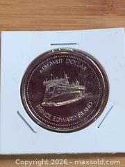 MaxSold Auction: Unc Trade Dollar Canada in 2x2 Flio - Battersea (Ontario, Canada) SELLER MANAGED Downsizing Online Auction - Battersea Road