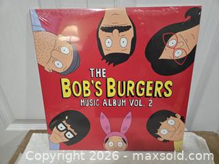 MaxSold Auction: Batman vinyl record and Bob's Burgers vol 2 - Abbotsford (British Columbia, Canada) SELLER MANAGED Downsizing Online Auction - Auguston Parkway South                 