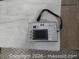 MaxSold Auction: Lot of 2 cameras  - Abbotsford (British Columbia, Canada) SELLER MANAGED Downsizing Online Auction - Auguston Parkway South                 