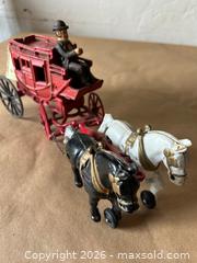 MaxSold Auction: Vintage Cast Iron Red Stagecoach with Driver - Glendale (California, USA) SELLER MANAGED Moving Online Auction - West Dryden Street