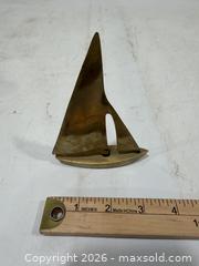 MaxSold Auction: Assorted Brass Items Candlestick, Vase, Sprayer, and Sailboat - Sacramento (California, USA) SELLER MANAGED Reseller Online Auction - Arden Way