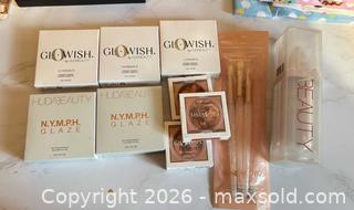 MaxSold Auction: Huda Beauty lot: Glowish powders, bronzers, highlighter & brush set -sc - Maple Ridge (British Columbia, Canada) PARTNER MANAGED Reseller Online Auction - Blanshard