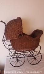 MaxSold Auction: Antique Wicker Baby Pram, Dome Canopy with Metal Frame & Spoked Wheels, sold as is - Kingston (Ontario, Canada) SELLER MANAGED Estate Sale Online Auction - Tamarac Street
