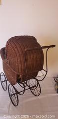 MaxSold Auction: Antique Wicker Baby Pram, Dome Canopy with Metal Frame & Spoked Wheels, sold as is - Kingston (Ontario, Canada) SELLER MANAGED Estate Sale Online Auction - Tamarac Street