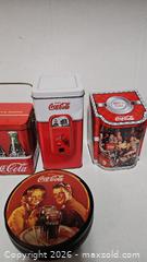 MaxSold Auction: Coca Cola Tin Collectibles Lot - Riverview (Florida, USA) SELLER MANAGED Downsizing Online Auction - Holly Heath Drive