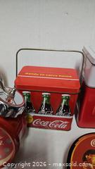 MaxSold Auction: Coca Cola Tin Collectibles Lot - Riverview (Florida, USA) SELLER MANAGED Downsizing Online Auction - Holly Heath Drive
