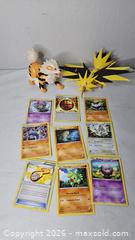 MaxSold Auction: Pokemon Lot  - Riverview (Florida, USA) SELLER MANAGED Downsizing Online Auction - Holly Heath Drive