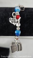 MaxSold Auction: Sterling Silver 925 Charm Bracelet - Riverview (Florida, USA) SELLER MANAGED Downsizing Online Auction - Holly Heath Drive