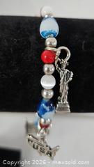 MaxSold Auction: Sterling Silver 925 Charm Bracelet - Riverview (Florida, USA) SELLER MANAGED Downsizing Online Auction - Holly Heath Drive