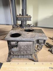 MaxSold Auction: Cast iron miniature parlor stoves lot of 2 — Crescent & Queen - Warwick (Rhode Island, USA) SELLER MANAGED Reseller Online Auction - Warwick Avenue