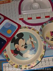 MaxSold Auction: Kids plates, Addition tables Placemat, pants & socks;  & utensils in a metal bucket   - Los Angeles  (California, USA) SELLER MANAGED Estate Sale Online Auction - Granville Avenue