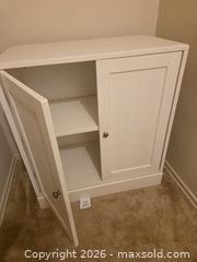 MaxSold Auction: White Wood Two-Door Cabinet with Adjustable Shelf - Los Angeles  (California, USA) SELLER MANAGED Estate Sale Online Auction - Granville Avenue