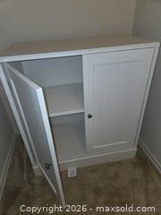 MaxSold Auction: White Wood Two-Door Cabinet with Adjustable Shelf - Los Angeles  (California, USA) SELLER MANAGED Estate Sale Online Auction - Granville Avenue