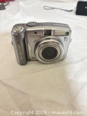 MaxSold Auction: Lot of 3 Compact Digital Cameras with Accessories - Toronto (Ontario, Canada) SELLER MANAGED Downsizing Online Auction - Rutherford Avenue