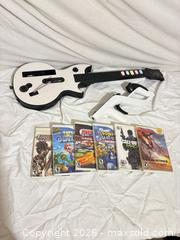 MaxSold Auction: Nintendo Wii Lot: Guitar, Wii Zapper, Remote, Nunchuk + 6 Games - Toronto (Ontario, Canada) SELLER MANAGED Downsizing Online Auction - Rutherford Avenue