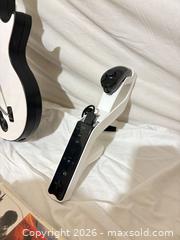 MaxSold Auction: Nintendo Wii Lot: Guitar, Wii Zapper, Remote, Nunchuk + 6 Games - Toronto (Ontario, Canada) SELLER MANAGED Downsizing Online Auction - Rutherford Avenue