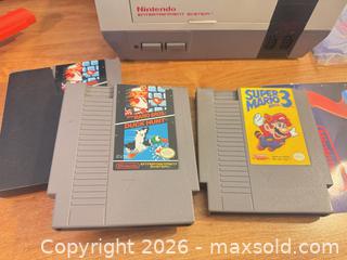 MaxSold Auction: Nintendo entertainment system with Mario games, Mario travel bag, controllers  - Almonte (Ontario, Canada) SELLER MANAGED Downsizing Online Auction - River Road