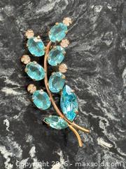 MaxSold Auction: Vintage Old 1940s Aqua Teal Floral Crystal Rhinestone Leaf Gold-Tone Open Back Brooch  - Pickering (Ontario, Canada) PARTNER MANAGED Estate Sale Online Auction - Granite Court