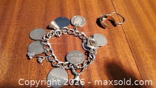 MaxSold Auction: Sterling Silver Charm Bracelet withCharms and  18k Gold  Rings A - Ottawa (Ontario, Canada) PARTNER MANAGED Downsizing Online Auction - Carling Avenue (CONDO)