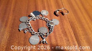 MaxSold Auction: Sterling Silver Charm Bracelet withCharms and  18k Gold  Rings A - Ottawa (Ontario, Canada) PARTNER MANAGED Downsizing Online Auction - Carling Avenue (CONDO)
