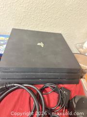 MaxSold Auction: PS4 Pro With 4 Controllers, Controller Changing Stand & Games Tested Works  - Glendale (Arizona, USA) SELLER MANAGED Reseller Online Auction - Bell Road (CONDO)