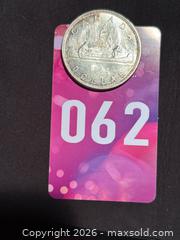 MaxSold Auction: 1962 CANADIAN SILVER DOLLAR Queen Elizabeth II COIN 80% Silver -  Nice!  - Aurora (Ontario, Canada) SELLER MANAGED Estate Sale Online Auction - Closs Square