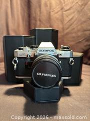 MaxSold Auction: Vintage Olympus OM10 , SLR 35 mm Film Camera with Olympus lens , F.Zuiko Auto-S 1:1.8 - Aurora (Ontario, Canada) SELLER MANAGED Estate Sale Online Auction - Closs Square