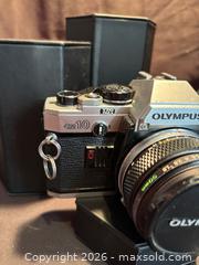 MaxSold Auction: Vintage Olympus OM10 , SLR 35 mm Film Camera with Olympus lens , F.Zuiko Auto-S 1:1.8 - Aurora (Ontario, Canada) SELLER MANAGED Estate Sale Online Auction - Closs Square