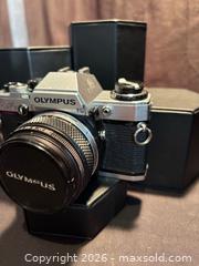 MaxSold Auction: Vintage Olympus OM10 , SLR 35 mm Film Camera with Olympus lens , F.Zuiko Auto-S 1:1.8 - Aurora (Ontario, Canada) SELLER MANAGED Estate Sale Online Auction - Closs Square
