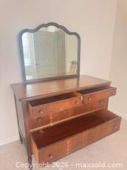 MaxSold Auction: Vintage Stained Wood Dresser with Scalloped Mirror - Raleigh (North Carolina, USA) PARTNER MANAGED Downsizing Online Auction - Fern Stone Court