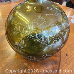 MaxSold Auction:  Alexander Sword Hand-Blown Olive Green Demijohn-Style Bottle with advertisement  - Leeds And The Thousand Islands (Ontario, Canada) SELLER MANAGED Downsizing Online Auction - Prince Street
