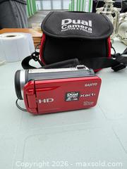 MaxSold Auction: Sanyo Xacti Red Digital Camcorder -iw - Maple Ridge (British Columbia, Canada) PARTNER MANAGED Estate Sale Online Auction - 203 Street (STORAGE)