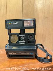 MaxSold Auction: Polaroid Sun 660 Instant Camera & Bushnell InstaFocus Binoculars - Wellesley (Massachusetts, USA) PARTNER MANAGED Downsizing Online Auction - Mayo Road