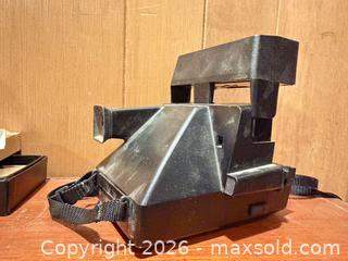 MaxSold Auction: Polaroid Sun 660 Instant Camera & Bushnell InstaFocus Binoculars - Wellesley (Massachusetts, USA) PARTNER MANAGED Downsizing Online Auction - Mayo Road