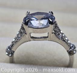 MaxSold Auction: Costume Jewelry ring.  Silver tone with large solitare and side stones - Burnaby (British Columbia, Canada) SELLER MANAGED Downsizing Online Auction - Claude Avenue