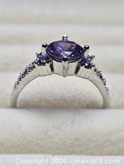 MaxSold Auction: Costume jewelry.  Silver tone ring with large Purple Solitare stone and side stones. - Burnaby (British Columbia, Canada) SELLER MANAGED Downsizing Online Auction - Claude Avenue