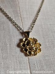 MaxSold Auction: Jewelry.   Dainty Gold tone flower pendant on gold tone chain - Burnaby (British Columbia, Canada) SELLER MANAGED Downsizing Online Auction - Claude Avenue
