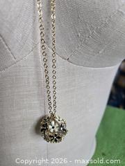 MaxSold Auction: Jewelry.  Floral black and white ball on Long Gold tone chain - Burnaby (British Columbia, Canada) SELLER MANAGED Downsizing Online Auction - Claude Avenue